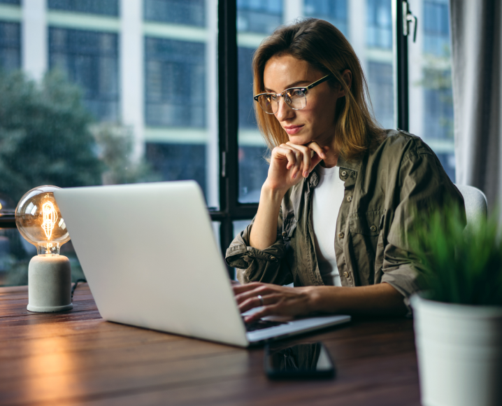 Woman looking at laptop