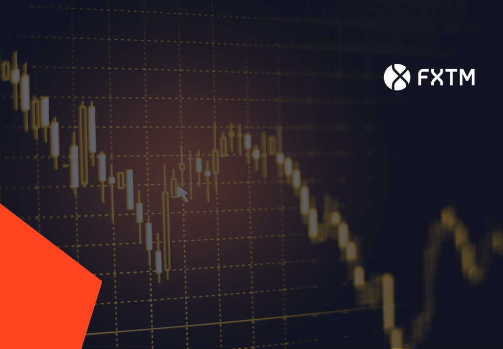 golden candlestick trading chart on a dark background